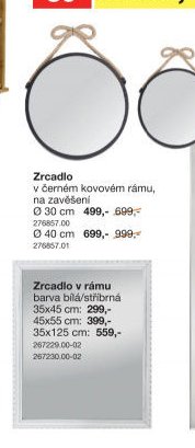 Zrcadlo v černém kovovém rámu
